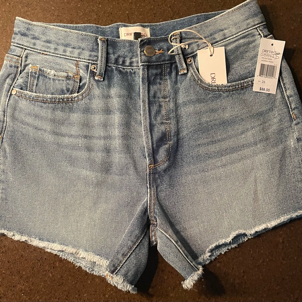 Driftwood cut off style high rise denim shorts. 4” inseam medium wash.
